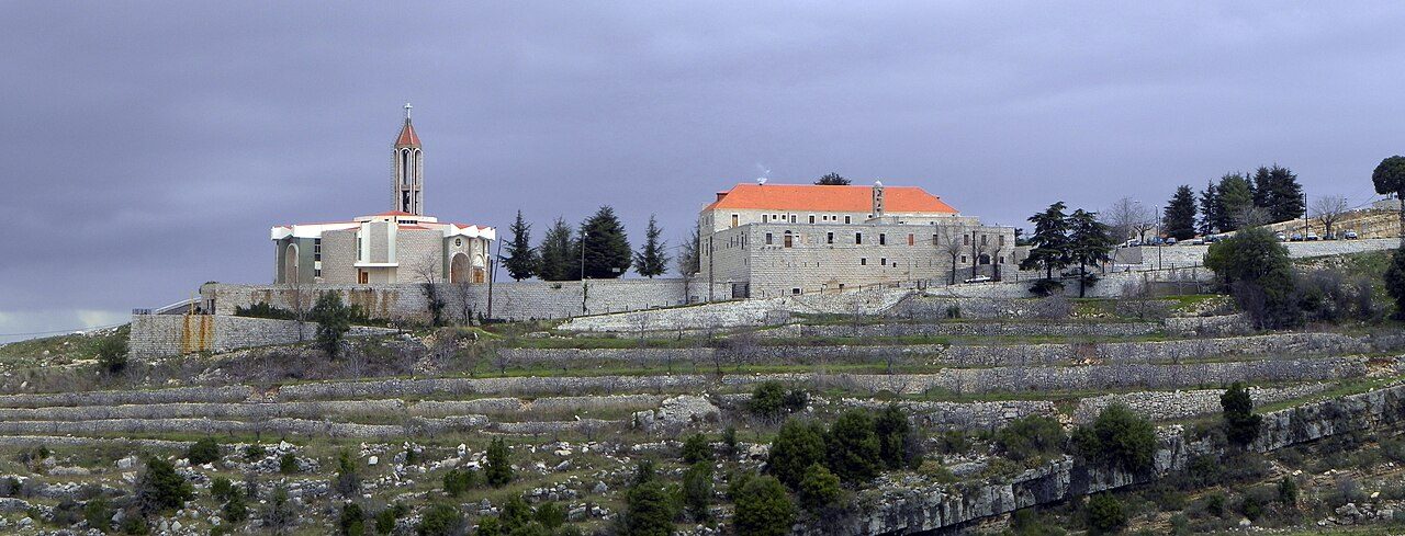 Annaya under a winter sky, the monastery crowning the hill.